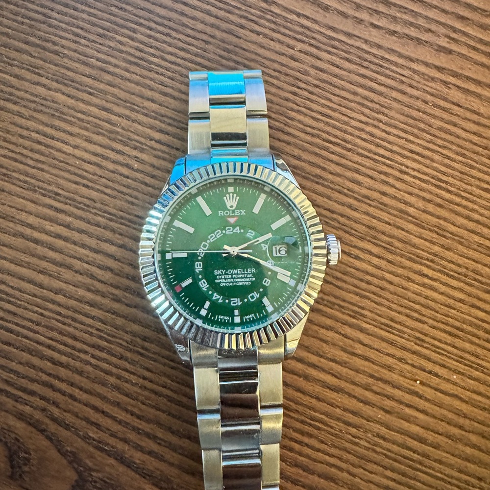 Rolex with Green Dial and Silver Bracelet
